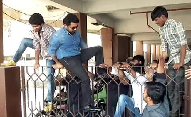 suriya jumping off back gate 1