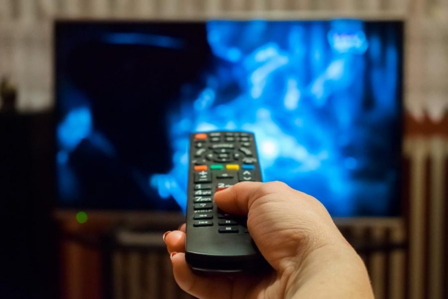 a woman watching tv
