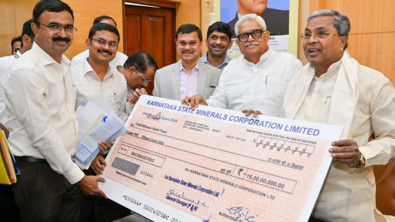 karnataka state mineral development corporation hands over rs. 1402 crore cheque to siddaramaiah