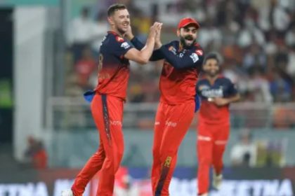 Virat Kohli joins in the celebration as Josh Hazlewood
